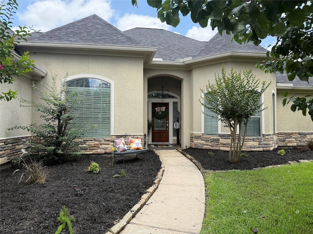 27326 S Karaugh Dr, Richmond, TX 77406 - entrance to property featuring stucco siding, stone siding, and roof with shingles