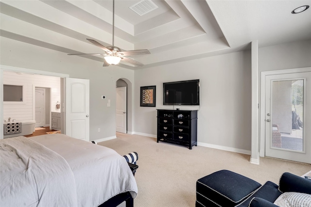27326 S Karaugh Dr, Richmond, TX 77406 - bedroom featuring a raised ceiling, arched walkways, light carpet, baseboards, and access to exterior