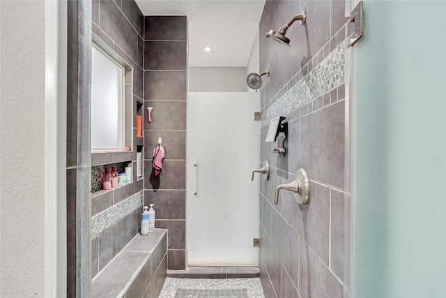 27326 S Karaugh Dr, Richmond, TX 77406 - bathroom featuring tile walls, a shower stall, and tile patterned flooring