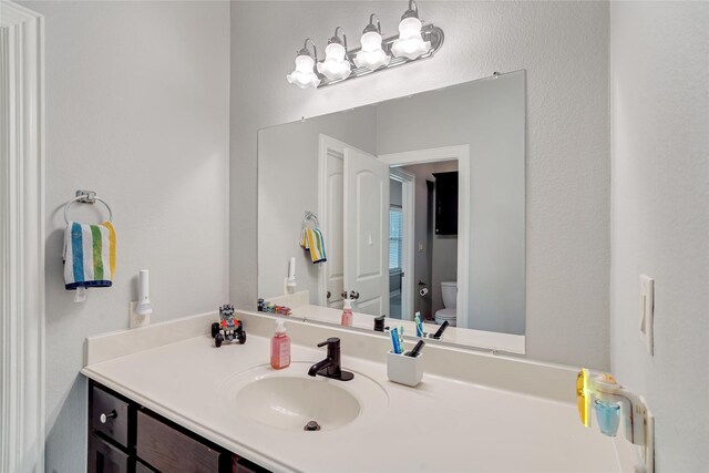 27326 S Karaugh Dr, Richmond, TX 77406 - bathroom featuring toilet and vanity