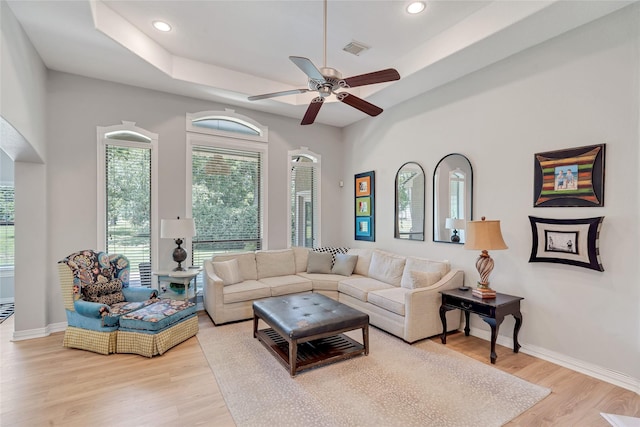 27326 S Karaugh Dr, Richmond, TX 77406 - living room featuring light wood-type flooring, ceiling fan, a tray ceiling, recessed lighting, and baseboards