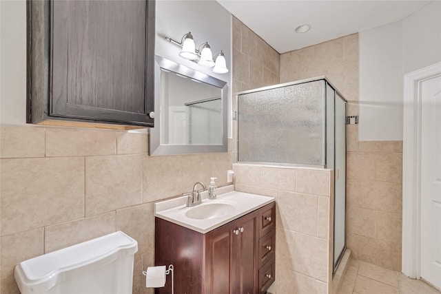 27326 S Karaugh Dr, Richmond, TX 77406 - full bath featuring tile walls, a stall shower, vanity, toilet, and tile patterned floors