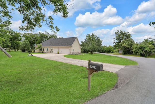 27326 S Karaugh Dr, Richmond, TX 77406 - view of side of property with a yard, driveway, and an attached garage