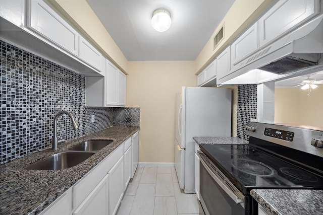 8429 Hearth Dr Unit 8, Houston, TX 77054 - kitchen with stainless steel electric range, a sink, extractor fan, white cabinetry, and backsplash
