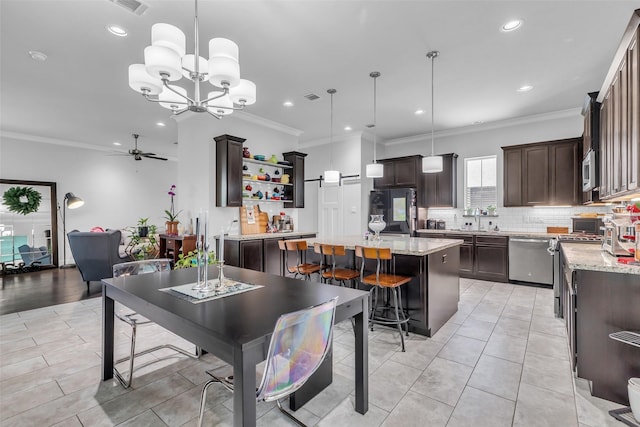 3009A Bell St, Houston, TX 77003 - kitchen with stainless steel appliances, dark brown cabinetry, a center island, open shelves, and a ceiling fan