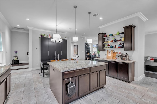 3009A Bell St, Houston, TX 77003 - kitchen featuring open shelves, dark brown cabinets, decorative light fixtures, crown molding, and light stone countertops