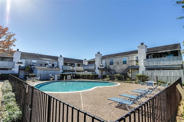 8787 Brae Acres Rd Unit 403, Houston, TX 77074 - community pool with a residential view and a patio