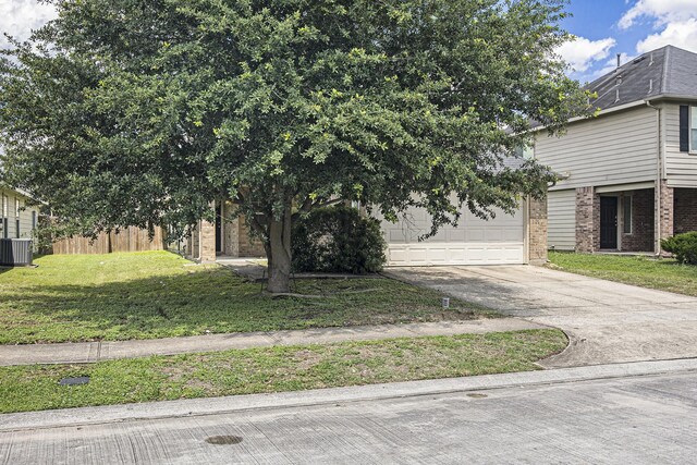 21606 Micheala Way, Humble, TX 77338 - view of front of house featuring brick siding, concrete driveway, central AC, and a garage