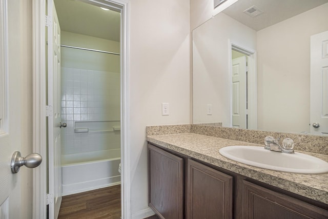21606 Micheala Way, Humble, TX 77338 - bathroom with vanity, wood finished floors, shower / bathtub combination, baseboards, and toilet