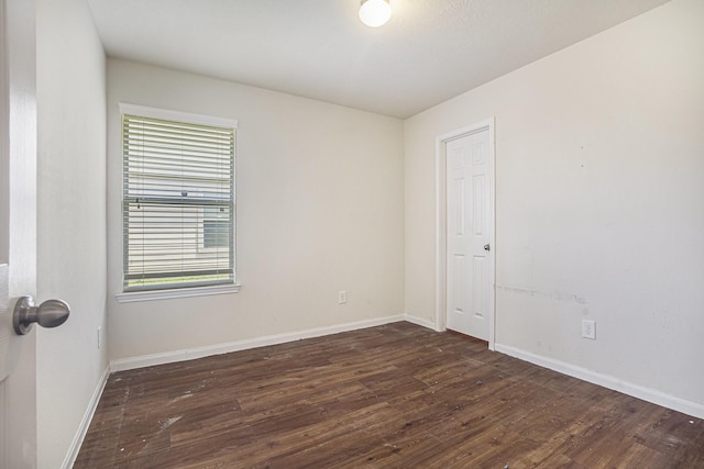 21606 Micheala Way, Humble, TX 77338 - spare room featuring dark wood-style flooring and baseboards