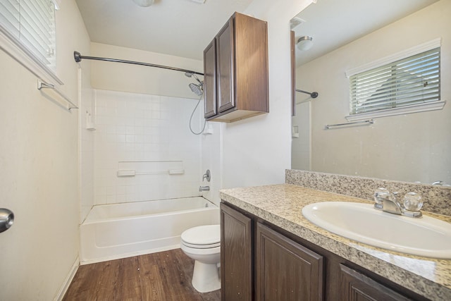 21606 Micheala Way, Humble, TX 77338 - bathroom featuring vanity, toilet, wood finished floors, and tub / shower combination
