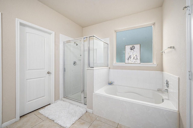 9407 Mineral Rock Ln, Richmond, TX 77407 - full bathroom with a bath, a shower stall, and tile patterned floors