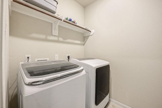 9407 Mineral Rock Ln, Richmond, TX 77407 - washroom with washing machine and clothes dryer