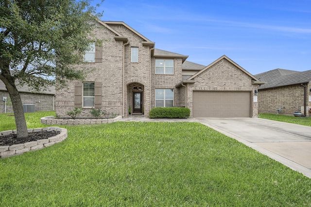 9407 Mineral Rock Ln, Richmond, TX 77407 - traditional-style home featuring an attached garage, driveway, a front lawn, brick siding, and central air condition unit