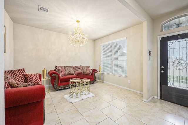 9407 Mineral Rock Ln, Richmond, TX 77407 - foyer entrance featuring a chandelier, tile patterned flooring, and baseboards