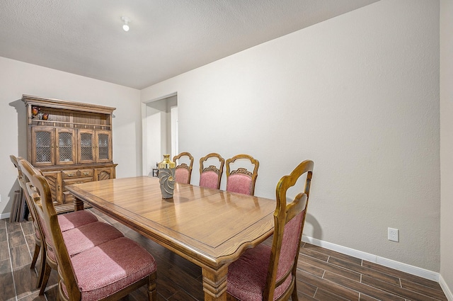 9407 Mineral Rock Ln, Richmond, TX 77407 - dining area featuring baseboards and dark wood-type flooring