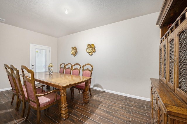 9407 Mineral Rock Ln, Richmond, TX 77407 - dining room featuring baseboards and dark wood-style floors