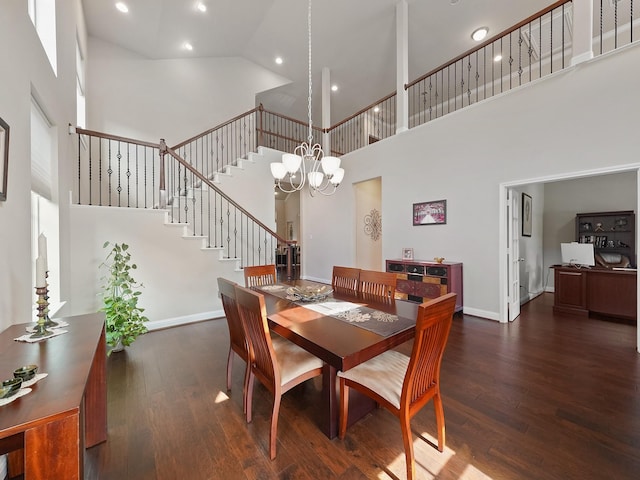 4202 Lodge Ranch Ct, Fulshear, TX 77441 - dining area featuring a high ceiling, wood finished floors, stairway, baseboards, and a chandelier