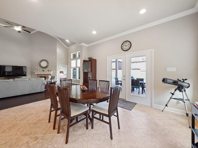 4202 Lodge Ranch Ct, Fulshear, TX 77441 - dining area featuring crown molding, french doors, light tile patterned floors, a ceiling fan, and baseboards