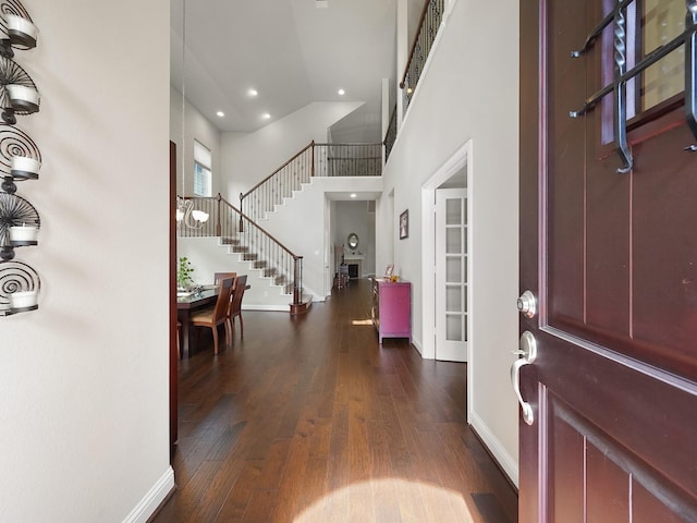 4202 Lodge Ranch Ct, Fulshear, TX 77441 - foyer featuring baseboards, stairway, dark wood-style floors, a towering ceiling, and recessed lighting