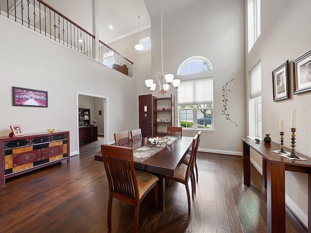 4202 Lodge Ranch Ct, Fulshear, TX 77441 - dining space featuring baseboards, a high ceiling, hardwood / wood-style flooring, a chandelier, and ornamental molding