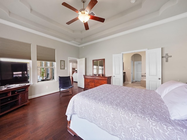 4202 Lodge Ranch Ct, Fulshear, TX 77441 - bedroom with a tray ceiling, dark wood-type flooring, arched walkways, baseboards, and a towering ceiling