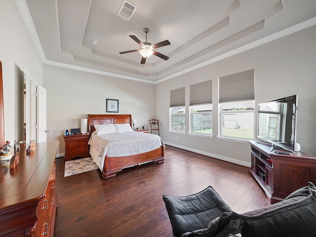 4202 Lodge Ranch Ct, Fulshear, TX 77441 - bedroom featuring a raised ceiling, dark wood-type flooring, crown molding, baseboards, and ceiling fan