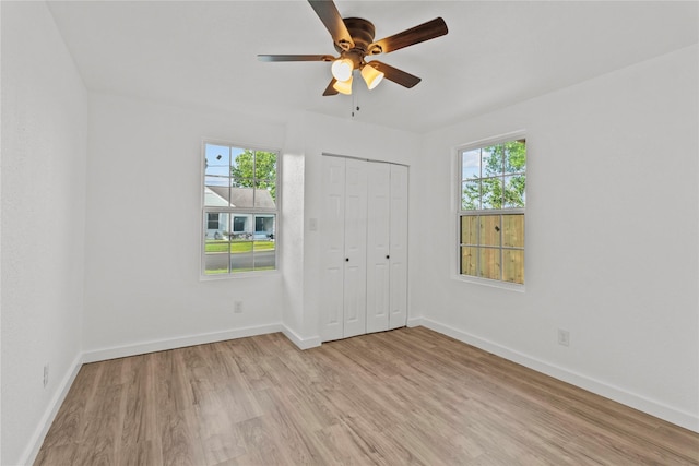 807 Aron St, Baytown, TX 77520 - unfurnished bedroom featuring light wood-style flooring, baseboards, and a closet
