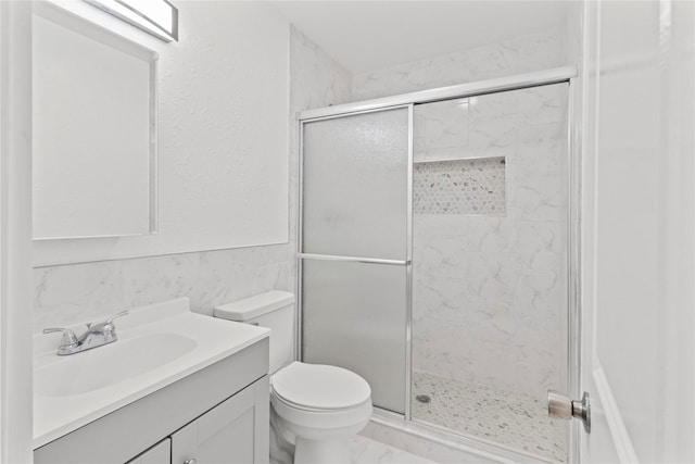 807 Aron St, Baytown, TX 77520 - bathroom with vanity, toilet, a stall shower, and marble finish floors