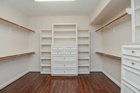 5422 Gibson St Unit A, Houston, TX 77007 - walk in closet with dark wood-type flooring
