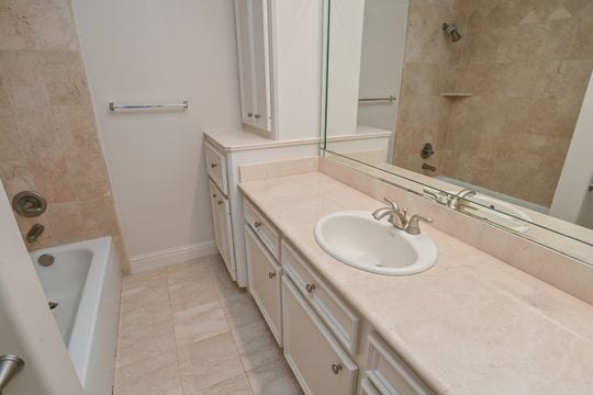 5422 Gibson St Unit A, Houston, TX 77007 - full bath with vanity, shower / bath combination, and baseboards