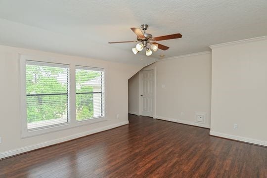 5422 Gibson St Unit A, Houston, TX 77007 - unfurnished room with wood finished floors, a ceiling fan, baseboards, and ornamental molding