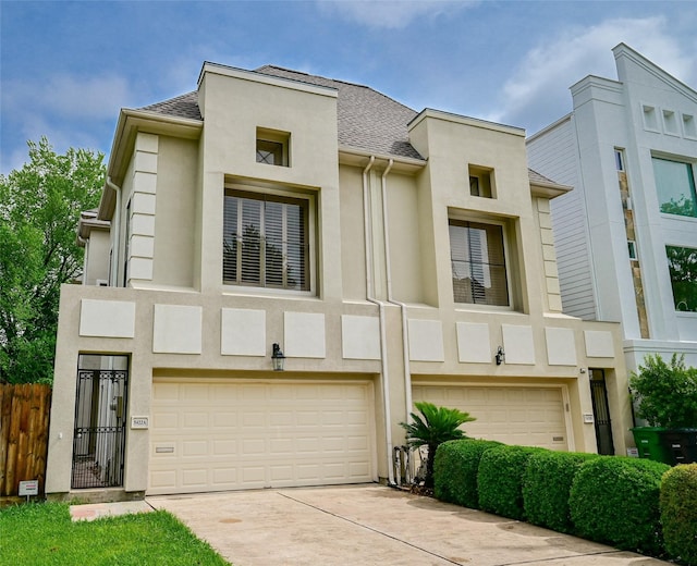 5422 Gibson St Unit A, Houston, TX 77007 - view of front facade featuring an attached garage, stucco siding, driveway, and a shingled roof