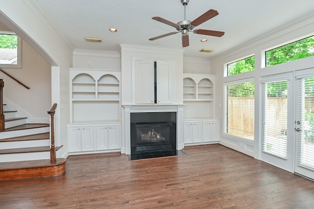 5422 Gibson St Unit A, Houston, TX 77007 - unfurnished living room featuring ornamental molding, a fireplace with flush hearth, wood finished floors, stairway, and built in features