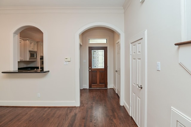 5422 Gibson St Unit A, Houston, TX 77007 - foyer entrance featuring baseboards, dark wood-style flooring, and ornamental molding