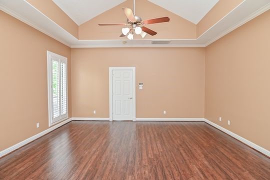 5422 Gibson St Unit A, Houston, TX 77007 - unfurnished room featuring dark wood-style floors, a ceiling fan, baseboards, and high vaulted ceiling