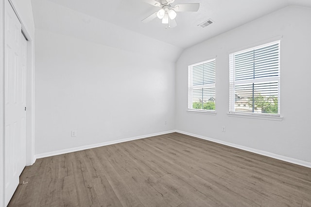14806 Meadow Acre Trl, Houston, TX 77049 - unfurnished bedroom featuring lofted ceiling, wood finished floors, baseboards, a closet, and ceiling fan
