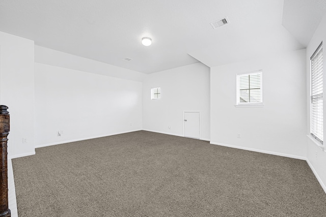 14806 Meadow Acre Trl, Houston, TX 77049 - additional living space with dark carpet and baseboards