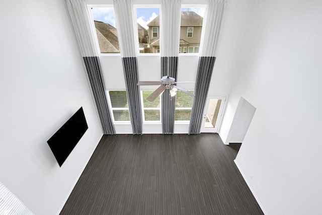 14806 Meadow Acre Trl, Houston, TX 77049 - unfurnished living room with a towering ceiling, ceiling fan, dark wood-style flooring, and plenty of natural light