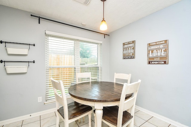18178 Holly Green Dr, Houston, TX 77084 - dining room featuring light tile patterned floors and baseboards
