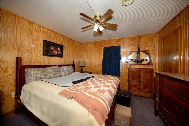 5332 County Road 1180, Kennard, TX 75847 - bedroom featuring carpet flooring, wooden walls, and a ceiling fan