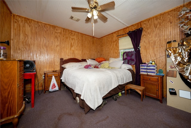 5332 County Road 1180, Kennard, TX 75847 - bedroom with wooden walls, carpet, and ceiling fan