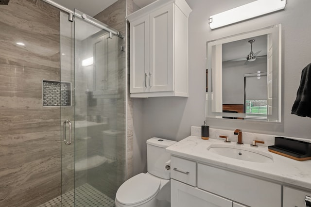 27457 S Lazy Meadow Way, Spring, TX 77386 - full bathroom featuring vanity, toilet, a stall shower, and ceiling fan