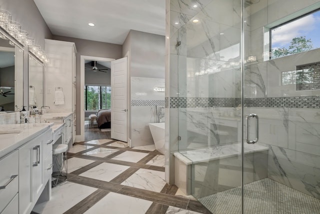 27457 S Lazy Meadow Way, Spring, TX 77386 - full bath featuring vanity, ensuite bath, a marble finish shower, ceiling fan, and a soaking tub