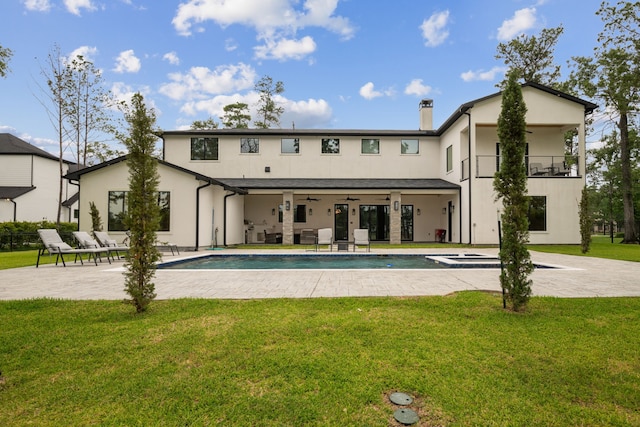 27457 S Lazy Meadow Way, Spring, TX 77386 - back of house with a patio, a lawn, ceiling fan, an outdoor pool, and stucco siding