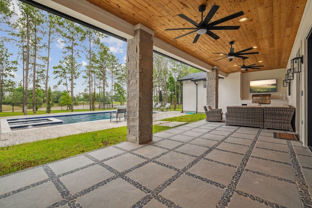 27457 S Lazy Meadow Way, Spring, TX 77386 - view of patio with an outdoor kitchen, a ceiling fan, and a pool with connected hot tub