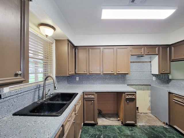 1703 Raintree St, Baytown, TX 77520 - kitchen featuring backsplash and light countertops