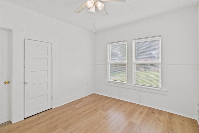 706 E Hunnicutt St, Baytown, TX 77520 - empty room featuring light wood-style floors, a ceiling fan, ornamental molding, and baseboards