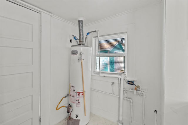 706 E Hunnicutt St, Baytown, TX 77520 - doorway to outside featuring water heater and crown molding
