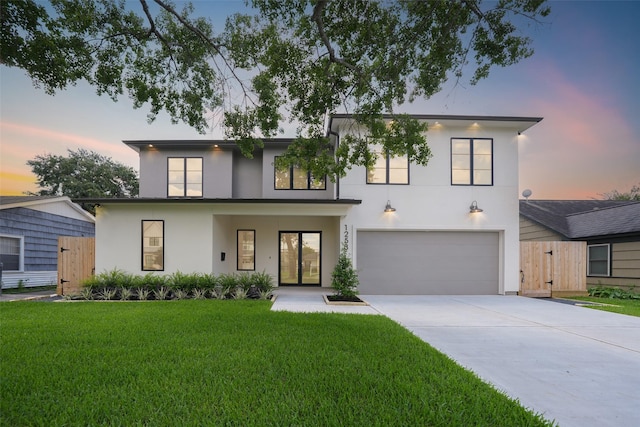 1253 Lamonte Ln, Houston, TX 77018 - contemporary house with stucco siding, a garage, and driveway